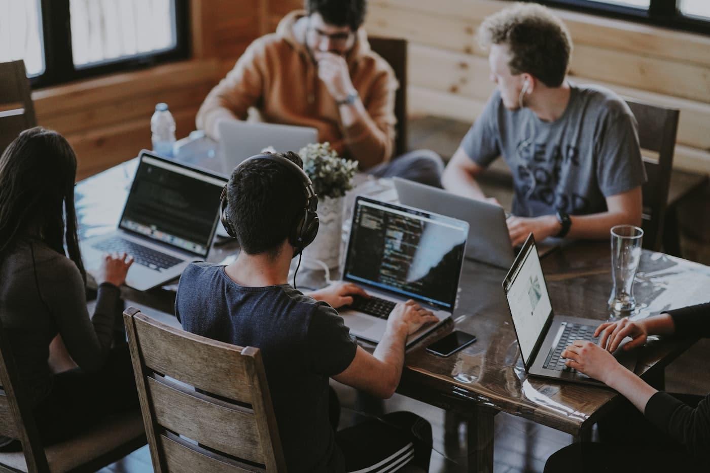 Team at laptops — the Aroma Systems door on the homepage